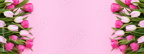 Pink Holiday banner. Bouquet of pink tulips on pink background. Mothers day, Valentines Day, Birthday celebration concept. Copy space, top view