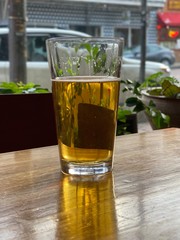 beer on wooden table in the window