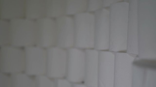 Toilet Paper Rolls Stacked In Rows. Light Moves To The Right