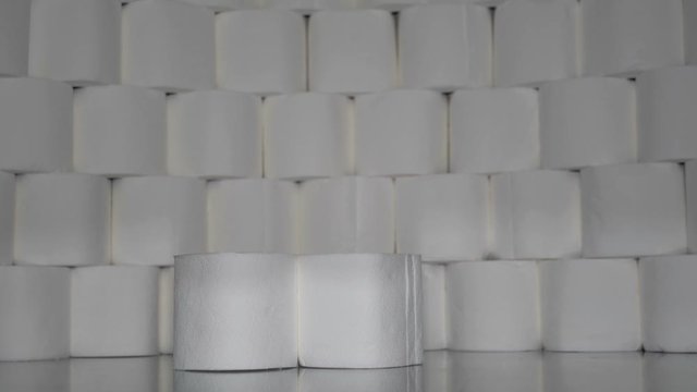 Man Gathers Toilet Paper Rolls One After Another.