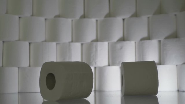 Falling Toilet Paper Rolls. 4K Slow Motion Footage