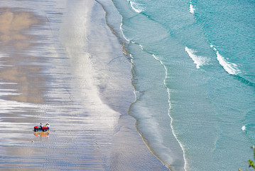 Beach sea view, aerial. A New Zealand fisherman uses fishing torpedo, is a popular option for deploying snapper long lines well offshore.