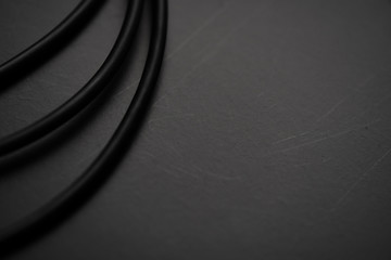 Black wire on black background.