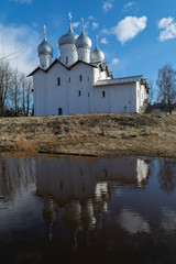 Fototapeta na wymiar Veliky Novgorod. Church of Boris and Gleb in Carpenters with reflection in the water