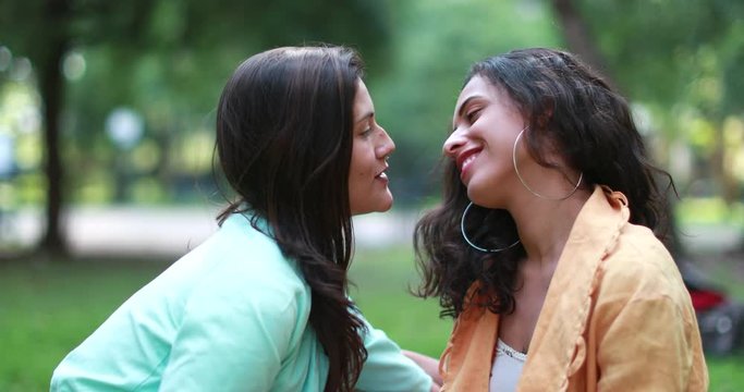 Flirtatious female lesbian couple outdoors