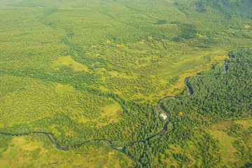 aerial view of Kamchatka volcanos, green valleys, snow and ice and the wonderful view of pure nature.