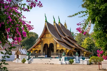 Foto op Canvas Wat Xieng Thong temple with blue sky, Luang Prabang, Laos © SUTHIKAIT