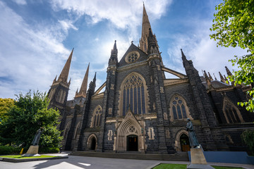 Fototapeta na wymiar St Patrick's Cathedral. Spire a Roman Catholic Cathedral church with blue sky at Eastern hill in Melbourne, Victoria, Australia