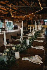  Decorated tables with candles and floral arrangements for celebration