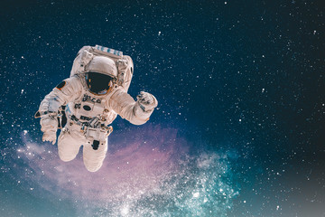 Astronaut in outer space. Elements of this image furnished by NASA.