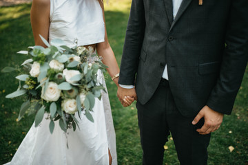  The bride in a beautiful dress and the groom in a suit on their wedding day