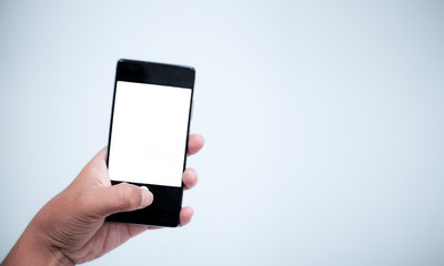 hand holding smart phone with blank screen isolated on white