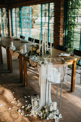  Decorated tables with candles and floral arrangements for celebrationv