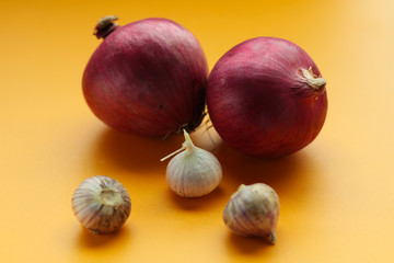 onions on yellow background