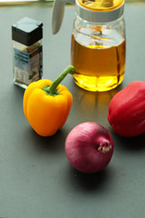 Peppes and oil can on the table