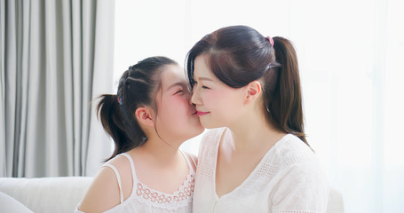 daughter kiss mom tenderly