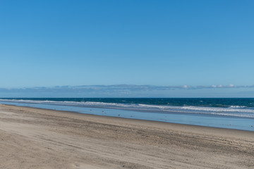Fototapeta na wymiar Desolate Zuma Beach vista during California stay-at-home order, Malibu