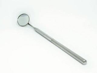dental mirror on white background
