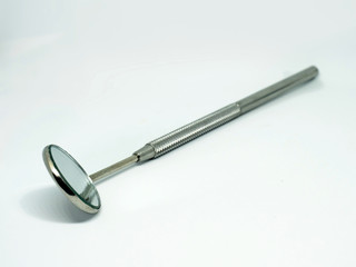 Dental mirror tool on white, dental hygiene