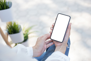 Mockup image blank white screen cell phone.woman hand holding texting using mobile.background empty space for advertise text.people contact marketing business,technology