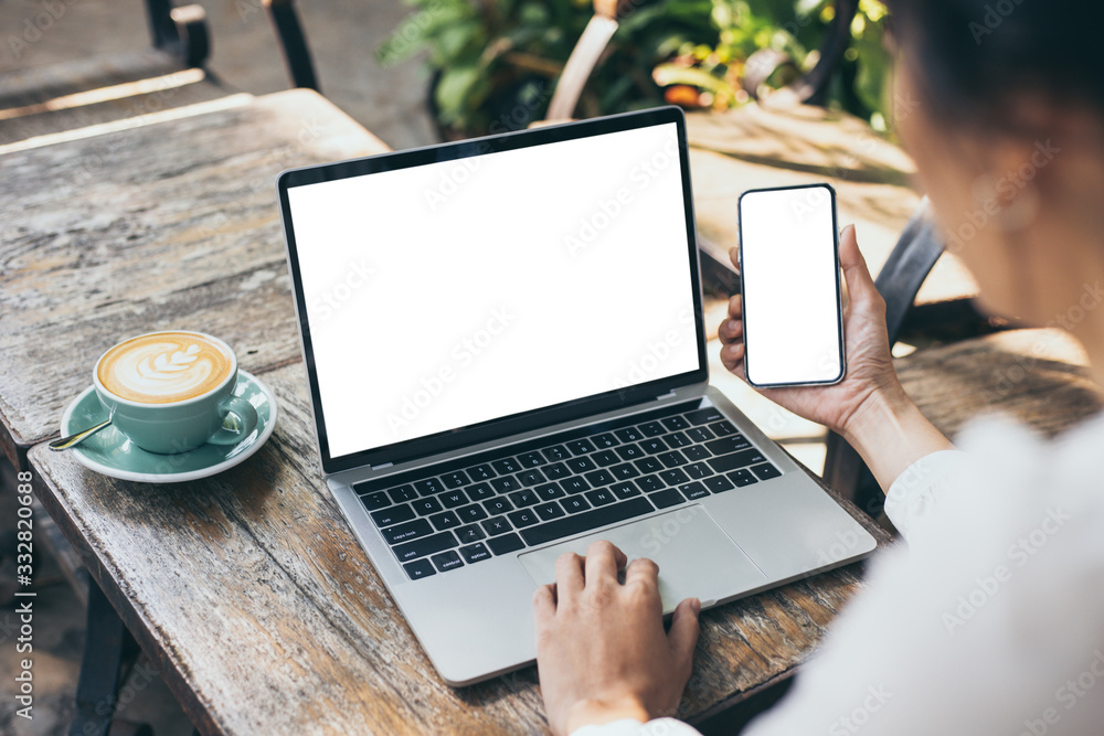 Wall mural mockup image blank screen computer,cell phone with white background for advertising text,hand woman 