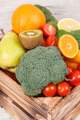 Natural fruits and vegetables in wooden box. Nutritious food containing minerals and vitamins