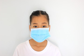 Children girl is protective surgical mask on their face  and prevent  Air pollution pm2.5 concept and  Coronavirus Covid-19.