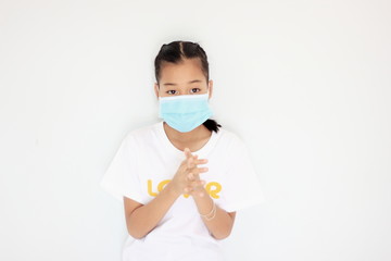 Children girl is protective surgical mask on their face  and prevent  Air pollution pm2.5 concept and  Coronavirus Covid-19.
