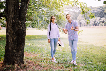 Couple young teen lover standing together at public park