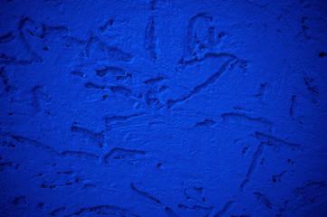 The texture of the foam concrete wall is painted in a classic blue color. The decorative panel. Background for the designer