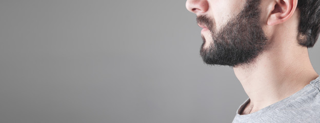 Fototapeta premium Caucasian bearded man in grey background.