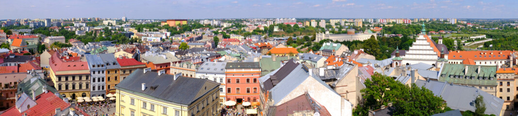 Fototapeta na wymiar Lublin, Poland - Panoramic view of old town quarter with market square and historic XVI century High Royal Court building - Trybunal Glowny Koronny