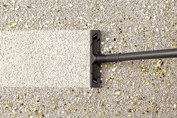 Hoovering of carpet with vacuum cleaner, top view