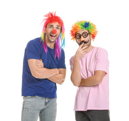 People in funny disguise on white background. April fools' day celebration