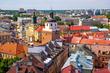 Lublin, Poland - Panoramic view of historic old town quarter with Cracow Gate tower - Brama Krakowska - and City Hall buildings - obrazy, fototapety, plakaty
