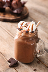 Mason jar of hot chocolate on table