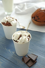 Cups of hot chocolate on table
