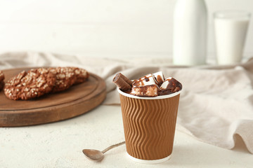 Cup of hot chocolate on table