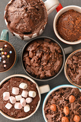 Chocolate mug cakes on dark background