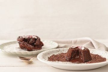 Tasty chocolate cakes on table