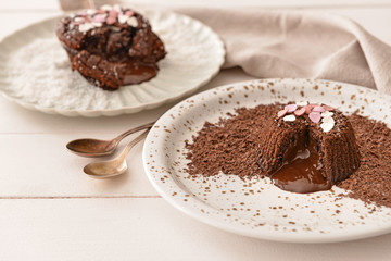 Tasty chocolate cakes on table