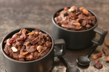 Chocolate mug cakes on dark background