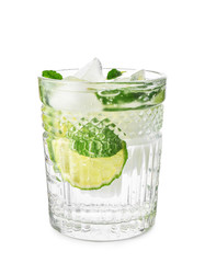 Glass of fresh lime lemonade on white background