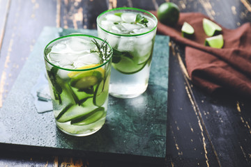 Glasses of fresh lime lemonade on table