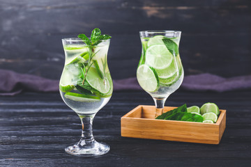 Glasses of fresh lime lemonade on table