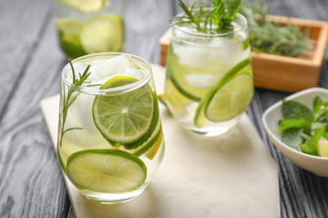 Glasses of fresh lime lemonade on table