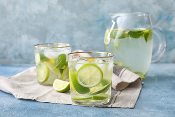 Glassware of fresh lime lemonade on table