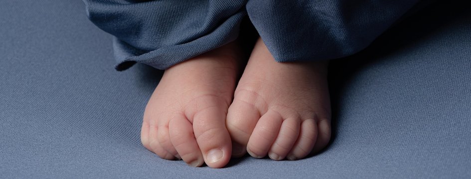 Close up of tiny foot of newborn baby stock photo