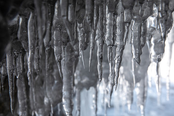 Ice details of the frozen lake Baikal during a winter sunrise. Irkutsk, Siberia, Russia.