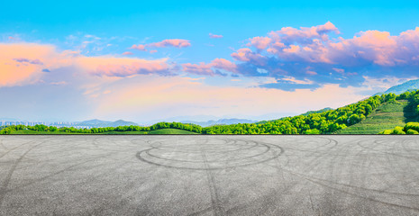 Race track road and green tea mountain nature landscape at sunset,panoramic view.